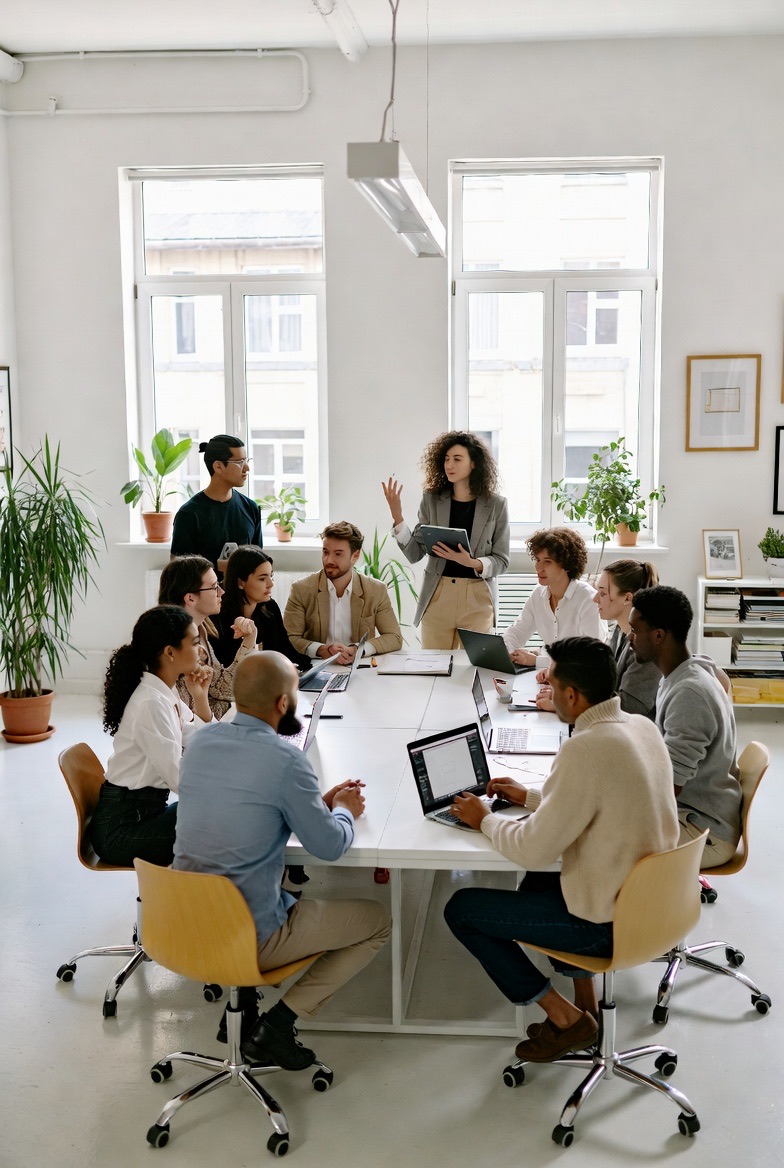 A product team collaborating around a large table